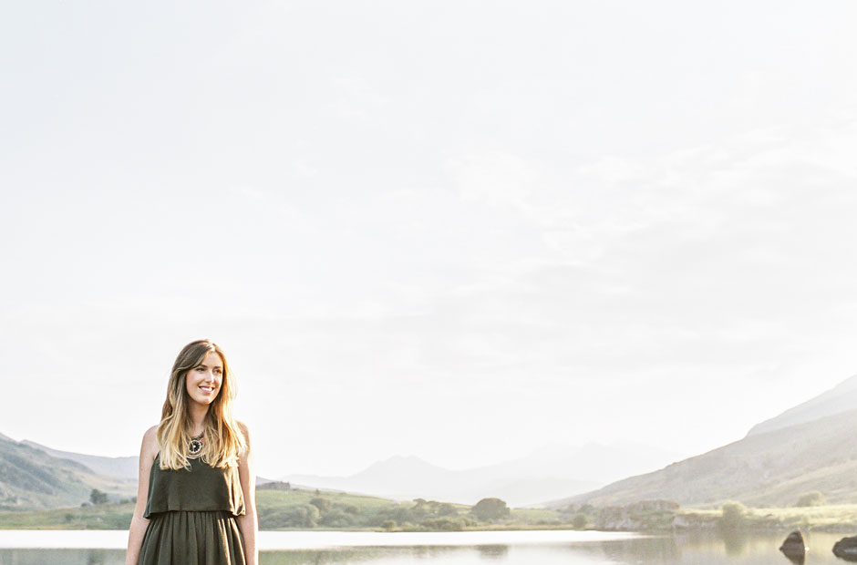 A girl in the mountains of Snowdonia with a lake in the background